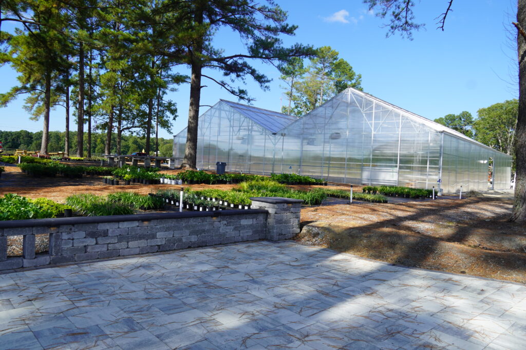 a view of our hardscape and glass greenhouse