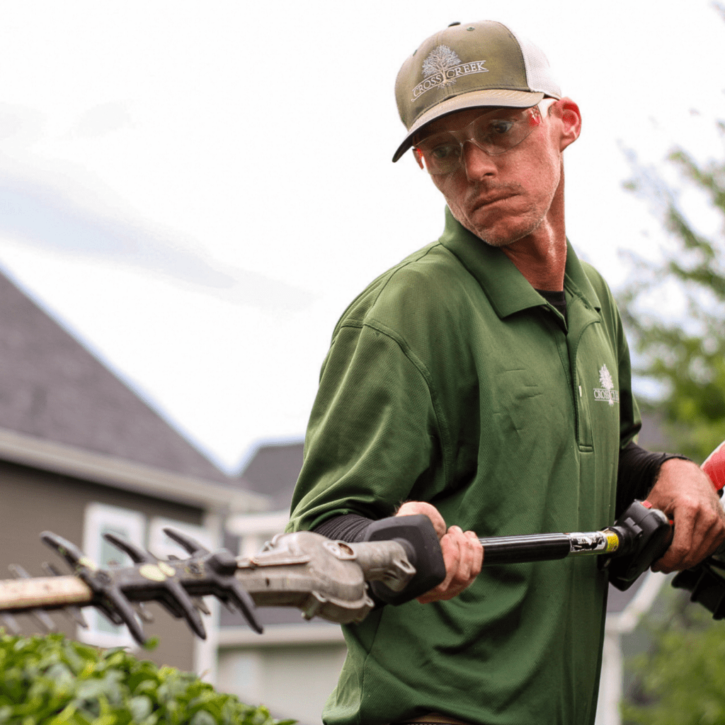 grounds management crew pruning