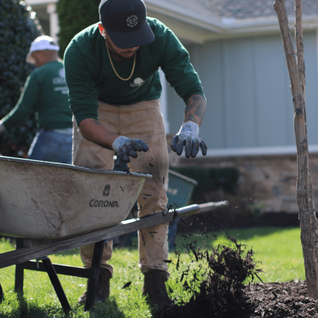 grounds management crew mulching