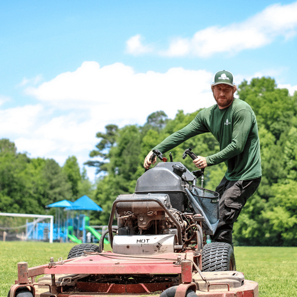 grounds management crew mowing