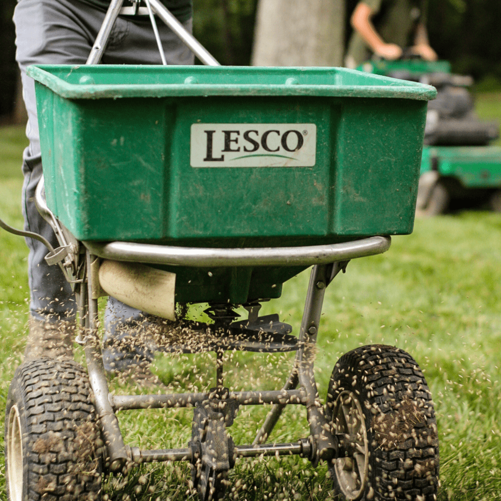 grounds management crew aeration and seeding