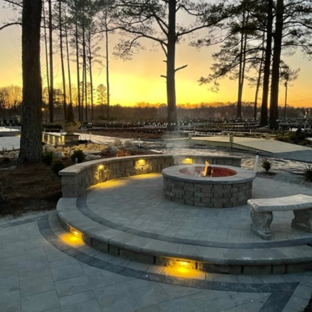 hardscape patio and firepit with in ground and cap light lighting