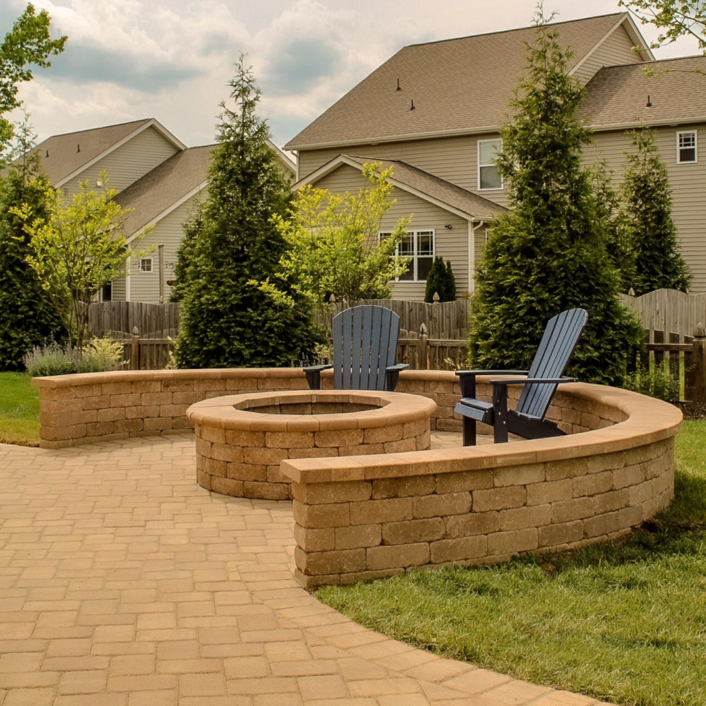 patio with firepit, seat wall, and fresh landscaping