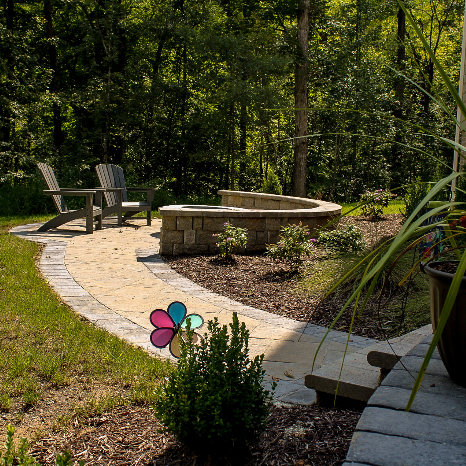 patio with walkway and patio with firepit and seat wall