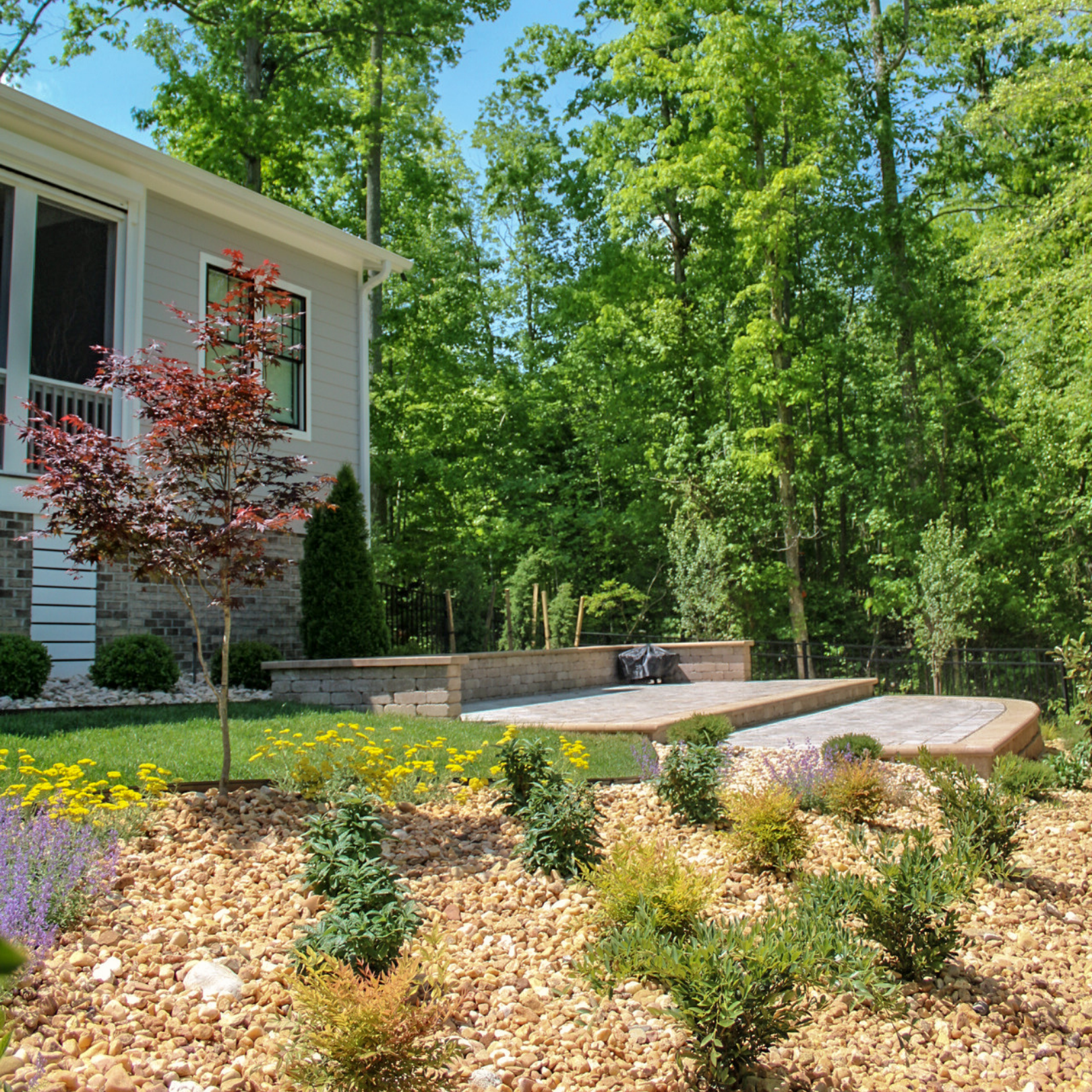 two level hardscape patio and fresh landscaping