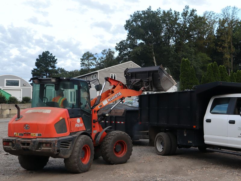 Truck being filled up with bulk stone.