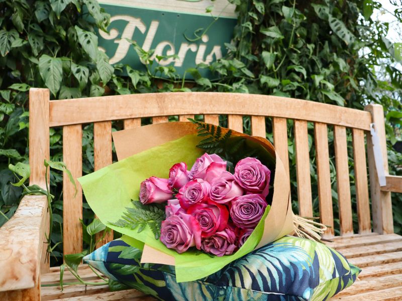 bouquet of pink rose staged on a bench
