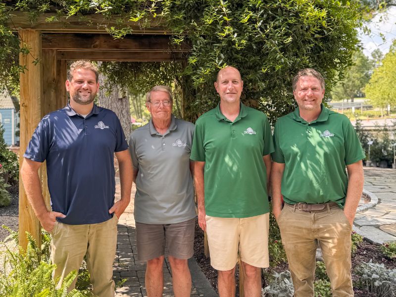 Andrew McAuliffe, Gene McAuliffe, Mark McAuliffe, and Jason McAuliffe standing in front of Cross Creek Nursery.