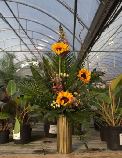 Vase arrangement with sunflowers.