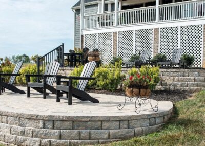 raised patio with two chairs