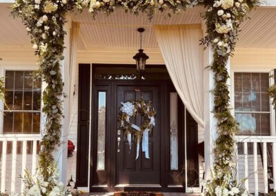 Private residence wedding floral door arrangement.
