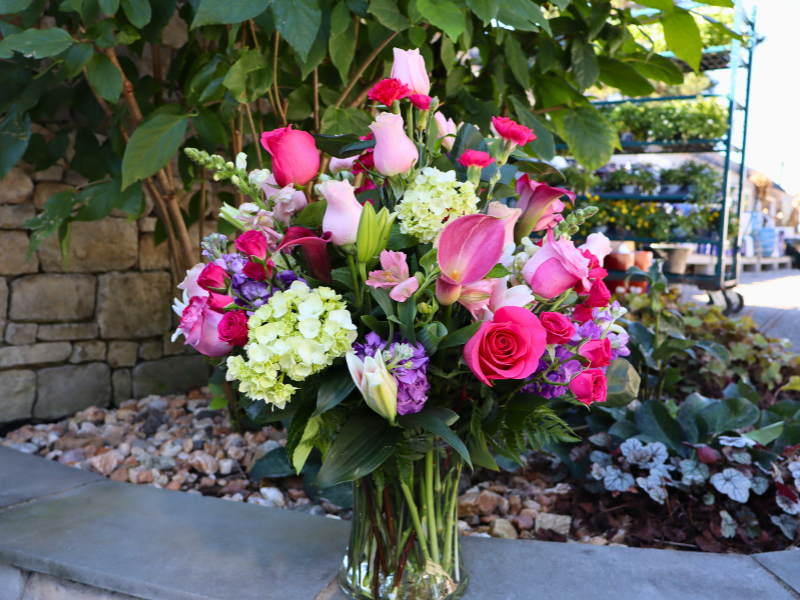 cross-creek-florist-floral-arrangement Floral arrangement with pink roses, calla lilies, and white hydrangeas.