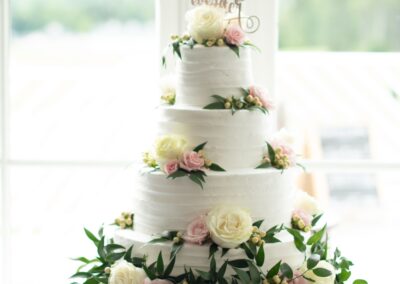 Floral cake arrangement designed by Cross Creek Florist.