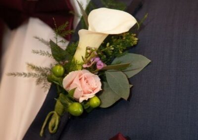 Floral corsage at wedding from Cross Creek Florist.